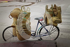 Vegetable fiber baskets being transported on a bicycle