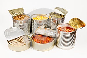 Vegetable and fish canned food on a white background. Food for hikers