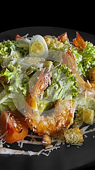 Vegetable and fish salad with tomatoes, cucumbers and avocado. Boiled egg. Bowl.