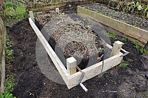 vegetable garden with raised wooden beds. arranging a wooden bed for cultivation