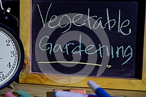 Vegetable gardening on phrase colorful handwritten on blackboard