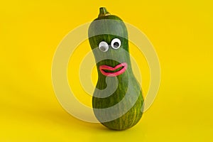 vegetable with googly eyes and mouths made of plasticine on a yellow background,GMO foods and hand made games with kids