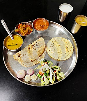Vegetable Gujarati kathiyawadi thali on table, Indian thali meal