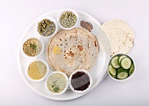 Vegetable Gujarati kathiyawadi thali on table, Indian thali meal