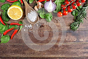 Vegetable ingredients on wooden background