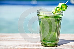 Vegetable juices on a wooden background.