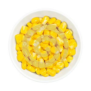 Sweet corn kernels, canned yellow vegetable maize, in a white bowl