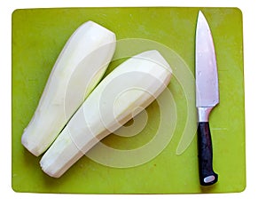 Vegetable marrows, knife on a chopping board