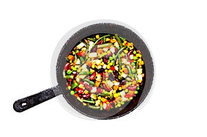 Vegetable mix in authentic pan on white background. Mexican food concept. Budget-friendly menu.Close-up