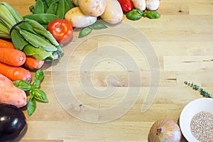 Vegetable mix on wooden table. Empty space for text or design. Health food concept for vegan, vegetarian, weight-loss diet.