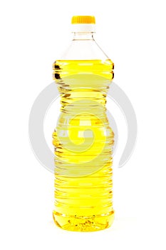 Vegetable oil in a bottle on a white background.