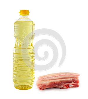 Vegetable oil in a bottler and Raw Pork