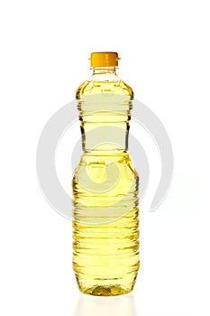 Vegetable oil for cooking in a bottle isolated on white