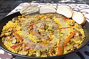 Vegetable paella made on fire with organic ingredients