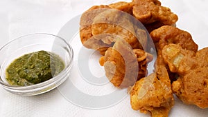 Vegetable pakora,Cauliflower pakora,served hot indian snack,served along with green chilly sauce