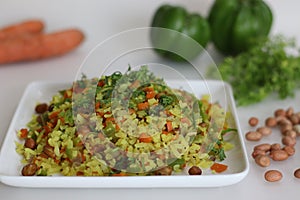 Vegetable Poha is a quick breakfast or snack made of beaten rice or flattened rice along peanuts, carrots and chilies