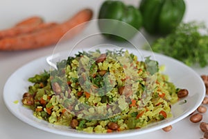 Vegetable Poha is a quick breakfast or snack made of beaten rice or flattened rice along peanuts, carrots and chilies