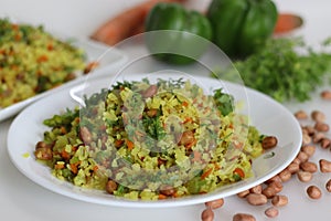 Vegetable Poha is a quick breakfast or snack made of beaten rice or flattened rice along peanuts, carrots and chilies