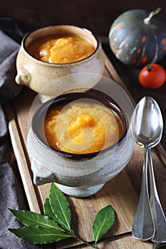 Vegetable pumpkin cream soup in two vintage tureen