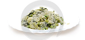 Vegetable risotto with cheese on white plate