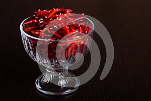 Vegetable salad of apple, carrot and beetroot with lemon juice, sesame seeds and vegetable oil in a glass bowl