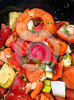 Vegetable salad in a black bowl