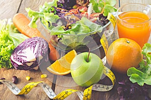 Vegetable salad bowl and fruit juice - healthy eating concept