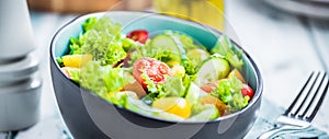 Vegetable salad bowl on kitchen table. Balanced diet