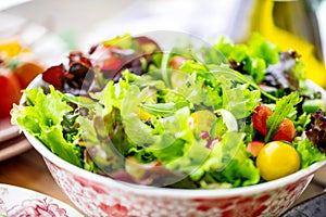 Vegetable salad bowl on kitchen table. Balanced diet.