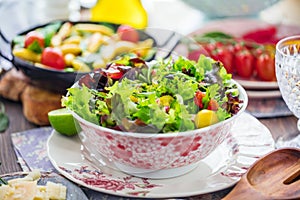 Vegetable salad bowl on kitchen table. Balanced diet.