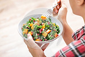 Vegetable salad bowl in woman hands