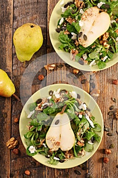 Vegetable salad with cheese, walnut and pear