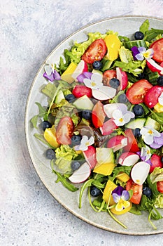 Vegetable salad decorated with flowers