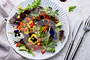 Vegetable salad with edible flowers