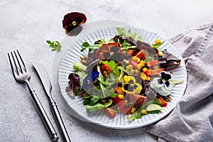 Vegetable salad with edible flowers