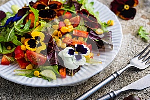 Vegetable salad with edible flowers