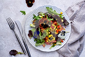 Vegetable salad with edible flowers