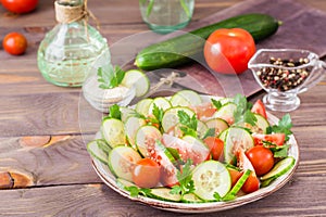 Vegetable salad of fresh cucumbers, tomatoes and parsley
