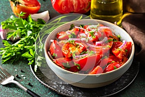 Vegetable salad with fresh tomato, onion and olive oil. Healthy food