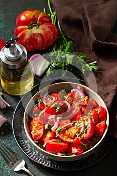 Vegetable salad with fresh tomato, onion and olive oil. Healthy food