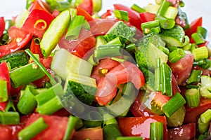 Vegetable salad with fresh tomatoes cucumbers and onions