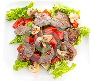 Vegetable salad with mashrooms and meat isolated
