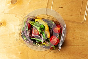 Vegetable salad in a plastic box.