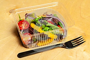 Vegetable salad in a plastic box.