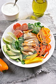 Vegetable salad with roasted chicken breasy