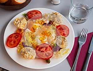 Vegetable salad with stuffed egg halves