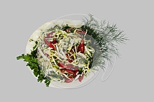 Vegetable salad - tomato, cabbage and greens on a gray background. ÃÂ¡lipping path photo
