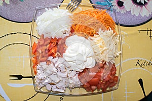 Vegetable salad of tomatoes, carrot onions and chicken