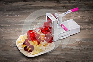 Vegetable slicer cutting vegetables