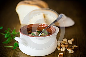 Vegetable soup with beans and meatballs in a ceramic bowl